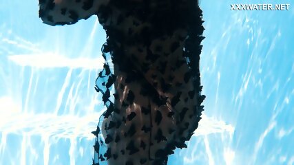 A Woman Floats In A Butterfly-Adorned Mesh Dress free video